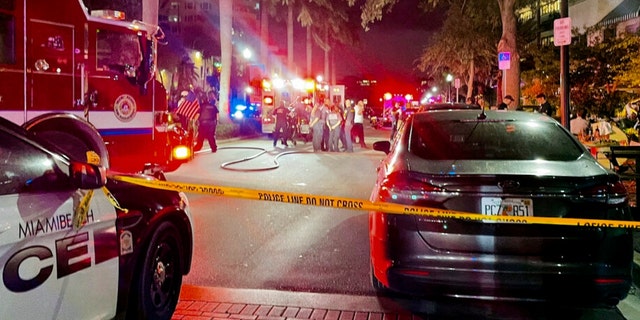 This photo provided by Miami Beach Police, Miami Beach Police and Fire respond to a traffic crash on Thursday, Feb. 24, 2022 in Miami Beach, Fla. A 75-year-old driver likely won't face criminal charges after crashing her Bentley into a busy Miami Beach sidewalk cafe, killing one man and injuring eight others, police said.