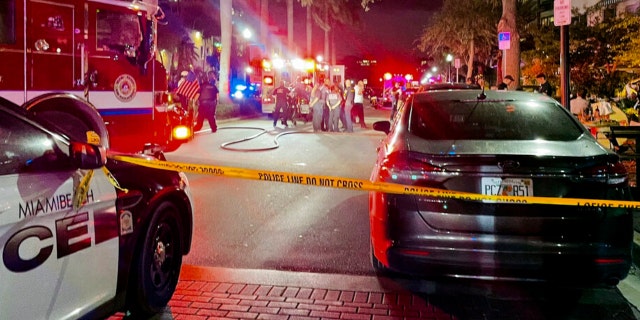 This photo provided by Miami Beach Police, Miami Beach Police and Fire respond to a traffic crash on Thursday, Feb. 24, 2022 in Miami Beach, Fla. A 75-year-old driver likely won't face criminal charges after crashing her Bentley into a busy Miami Beach sidewalk cafe, killing one man and injuring eight others, police said.