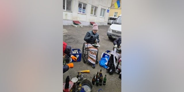 Volunteers mix up Molotov cocktails in Kyiv as Russian forces stall north of the city.