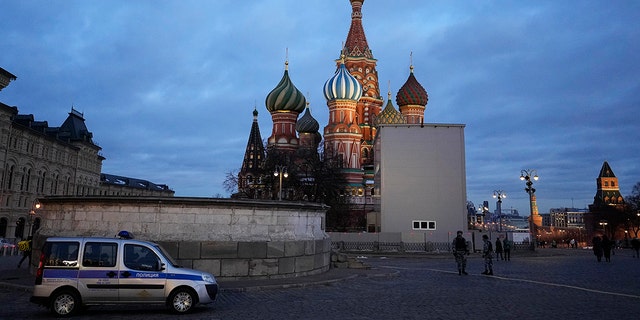 A police car is parked in Red Square, with St. Basil's Cathedral in the background, in Moscow, Russia, March 4, 2022.