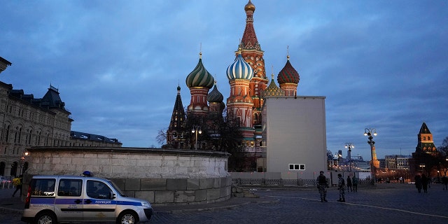 A police car is parked in Red Square, with St. Basil's Cathedral in the background, in Moscow, Russia, March 4, 2022.