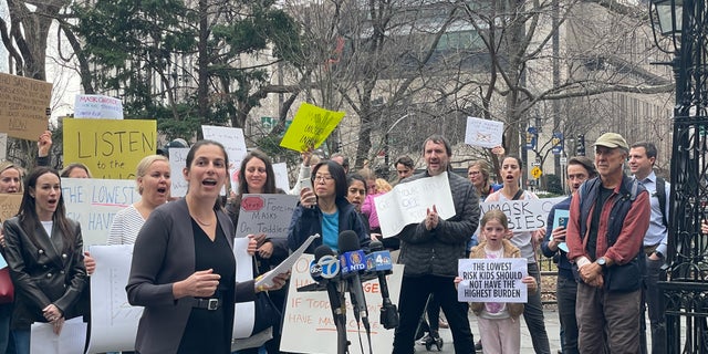 NYC parent Daniela Jampel speaks at an anti-mask rally outside City Hall March 7, 2022.