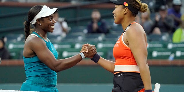 Naomi Osaka, of Japan, right, shakes hands with Sloane Stephens after defeating her at the BNP Paribas Open tennis tournament Thursday, March 10, 2022, in Indian Wells, Calif.