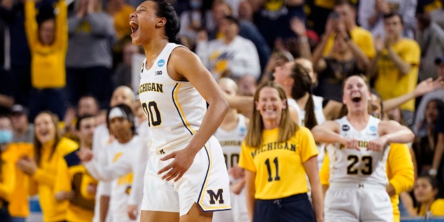 Michigan forward Naz Hillmon (00) and the team react during the closing seconds of the second half of a college basketball game in the second round of the NCAA tournament against Villanova, Monday, March 21, 2022, in Ann Arbor, Mich.