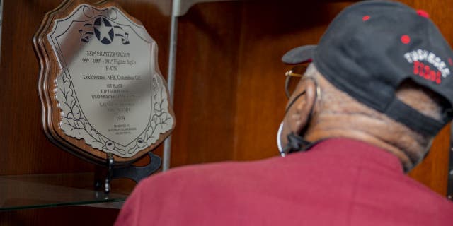 Air Force veterans Lt. Col. James H. Harvey III, Capt. Alva Temple, 1st Lt. Harry Stewart Jr. and alternate member 1st Lt. Halbert Alexander have been honored with a recognition plaque for the 1949 ‘Top Gun’ win for the 332nd Fighter Group.