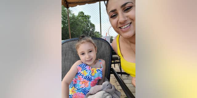 Six-year-old Rozara Estevez with her aunt, Gisselle Muniz