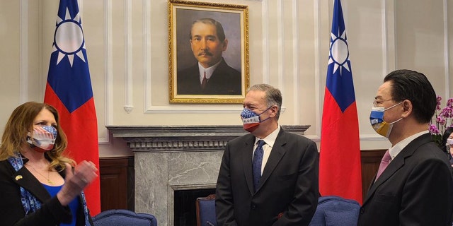 Susan Pompeo makes a point as former Secretary of State Mike Pompeo, center, and Taiwanese Foreign Minister Joseph Wu listens during the Pompeos' visit to Taipei, March 3, 2022. (Mike Pompeo Twitter)