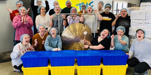 The Pack Shack volunteers helping pack meals for Ukraine refugees.