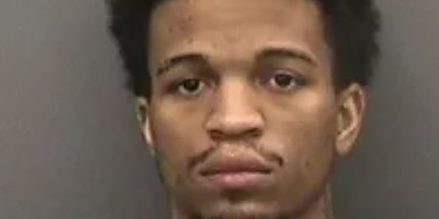 Corey Pujols, 27, was working at a Dunkin' store in Tampa when he punched a customer who used a racial slur against him