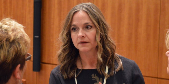 State Rep. Rebecca Dow, R-Truth or Consequences, speaks to staff before the start of the New Mexico Legislative session on Tuesday, Jan. 15, 2019, in Santa Fe, N.M.