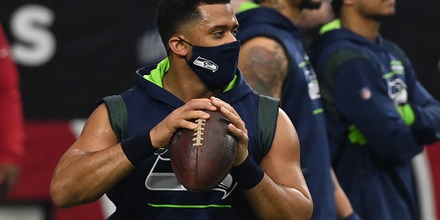 Russell Wilson of the Seattle Seahawks prepares for a game against the Cardinals at State Farm Stadium on Jan. 9, 2022, in Glendale, Arizona.