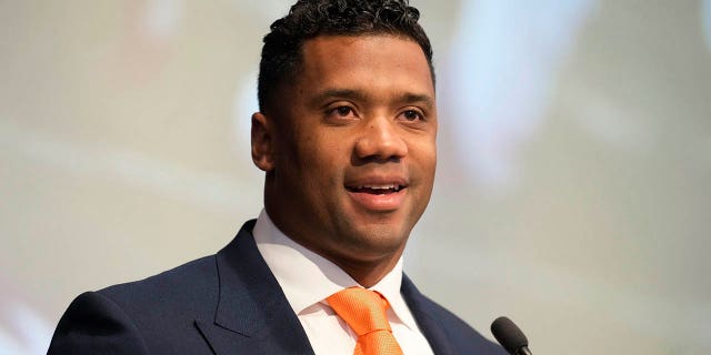 Denver Broncos new starting quarterback Russell Wilson speaks during a news conference Wednesday, March 16, 2022, at the team's headquarters in Englewood, Colo.