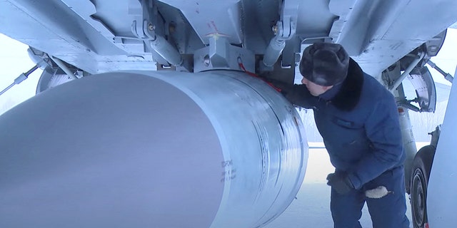 FILE - An airman checks a Russian Air Force MiG-31 fighter jet prior a flight with Kinzhal hypersonic missile during a drill in an unknown location in Russia, in this still image taken from video released February 19, 2022. 