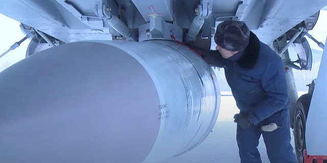 FILE - An airman checks a Russian Air Force MiG-31 fighter jet prior a flight with Kinzhal hypersonic missile during a drill in an unknown location in Russia, in this still image taken from video released February 19, 2022.