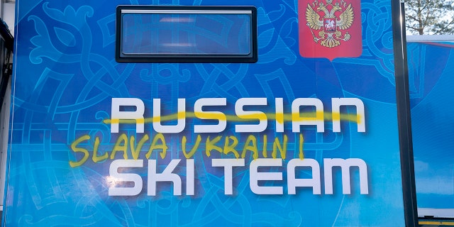 Writing reading "Glory to Ukraine" is seen on the side of the trailer of the Russian cross-country national team, in Holmenkollen. near Oslo, Wednesday, March 2, 2022. In Norway, Russian cross-country skiers, who won 11 medals at the Beijing Olympics, were heading home after being excluded from competition by the International Ski Federation, known as FIS.