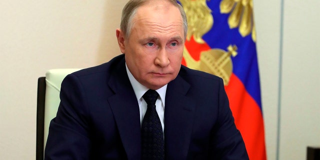 Russian President Vladimir Putin attends a cabinet meeting via videoconference outside Moscow on March 23, 2022.