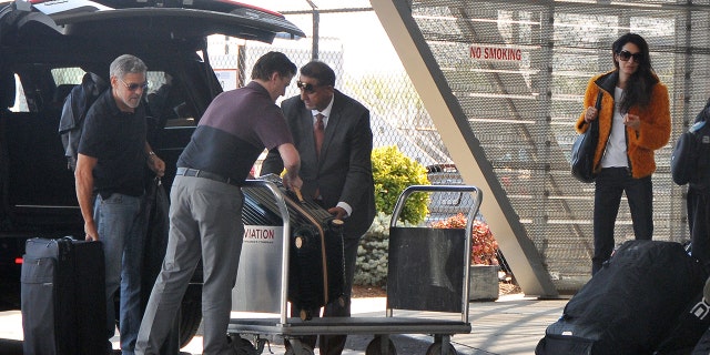 George Clooney and Amal Clooney are spotted at an airport in Washington D.C. on Monday.