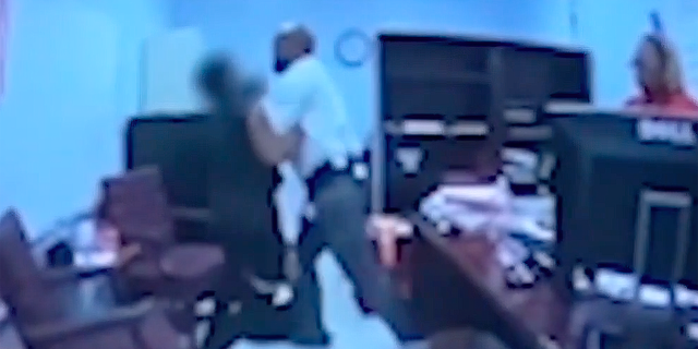Screen shot of Georgia high school coach Kenneth Miller confronting student who was in possession of a loaded gun