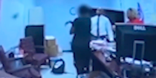 Screen shot of Georgia high school coach Kenneth Miller confronting student who was in possession of a loaded gun