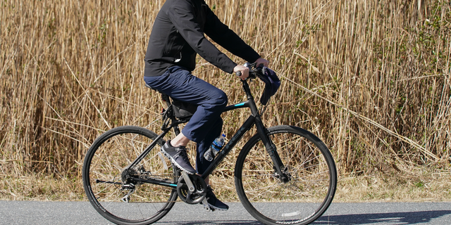 President Joe Biden rides a bicycle in Gordon's Pond State Park in Rehoboth Beach, Del., Sunday, March 20, 2022. (AP Photo/Carolyn Kaster)