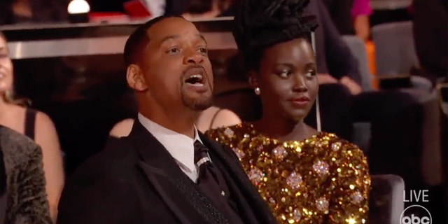 Will Smith yells at Chris Rock from his seat at the Oscar's after physically assaulting him on stage on Sunday, March 27, 2022.