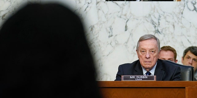 Sen. Dick Durbin, D-Ill., chairman of the Senate Judiciary Committee, listens as Supreme Court nominee Ketanji Brown speaks during her Senate Judiciary Committee confirmation hearing on Capitol Hill in Washington, Monday, March 21, 2022. 