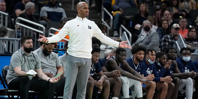 Saint Peter's head coach Shaheen Holloway questions a call during the first half of a college basketball game against Murray State in the second round of the NCAA tournament, Saturday, March 19, 2022, in Indianapolis.