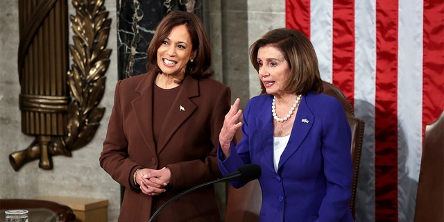 Vice President Kamala Harris talks with House speaker Nancy Pelosi of Calif., in the chamber of the House of Representatives before the State of the Union address by President Joe Biden to a joint session of Congress at the Capitol, Tuesday, March 1, 2022, in Washington.