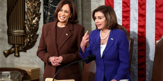 Vice President Kamala Harris talks with House speaker Nancy Pelosi of Calif., in the chamber of the House of Representatives before the State of the Union address by President Joe Biden to a joint session of Congress at the Capitol, Tuesday, March 1, 2022, in Washington.