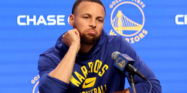 Golden State Warriors guard Stephen Curry talks to the media about his injury before an NBA basketball game against the San Antonio Spurs in San Francisco, Sunday, March 20, 2022.