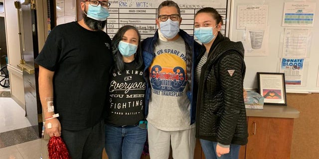 Before the transplant, Sanders (second from right) and Perez (far left) talked on the phone and hit it off. "It was an immediate connection," Sanders said. The men are shown here with members of their families. 