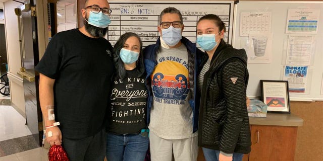Before the transplant, Sanders (second from right) and Perez (far left) talked on the phone and hit it off. "It was an immediate connection," Sanders said. The men are shown here with members of their families.