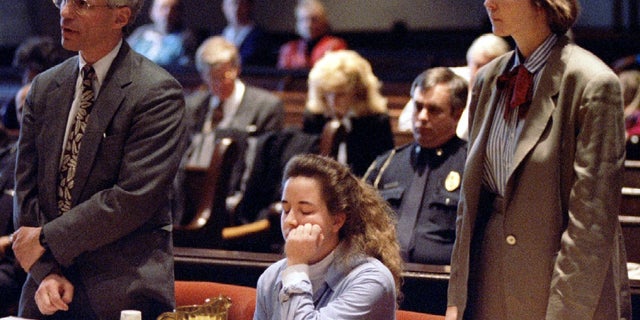 Susan Smith is seated between her lawyers during a court hearing in the Union County Courthouse.