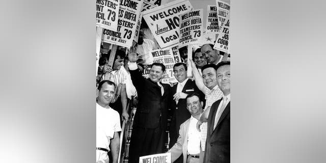This undated photo shows Teamsters Union President James R. Hoffa, left, standing with Anthony Provenzano, right, and fellow union members during Hoffa's visit to New Jersey.