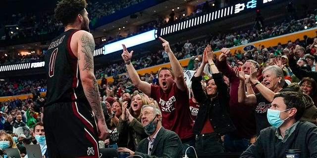 New Mexico State guard Teddy Allen (0) reacts to fans after scoring against Connecticut late in the second half of a college basketball game in the first round of the NCAA men's tournament Thursday, March 17, 2022, in Buffalo, N.Y.