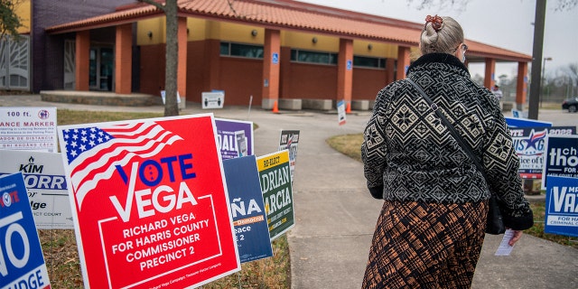 A person walks to cast their ballot at the Moody Community Center on Feb. 24, 2022, in Houston.