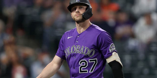 Trevor Story of the Colorado Rockies walks to the dugout after striking out against the San Francisco Giants at Coors Field Sept. 24, 2021, in Denver, Colo.