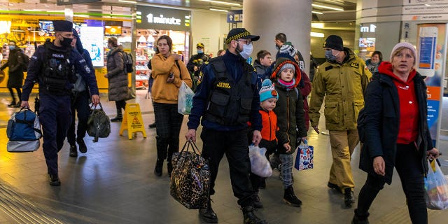 People arrive at a help center organized by volunteers, following Russia's invasion of Ukraine, in Bydgoszcz, Poland, March 10, 2022.