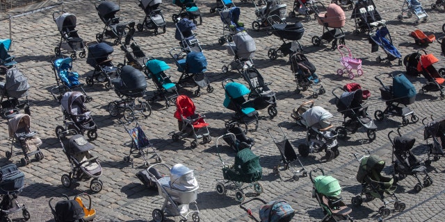 Half of Ukraine's children displaced: 'A grim milestone' 4 Empty strollers were placed in neat rows at the central square in Lviv, Ukraine, March 17, to symbolize children killed in the ongoing war.