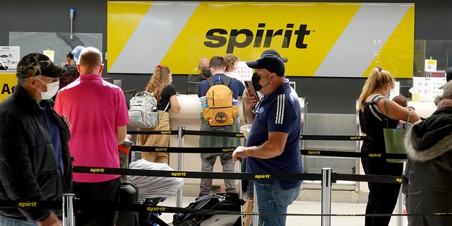 Passengers check in at the Spirit Airlines counter at the Fort Lauderdale-Hollywood International Airport on Feb. 07, 2022 in Fort Lauderdale, Florida. 