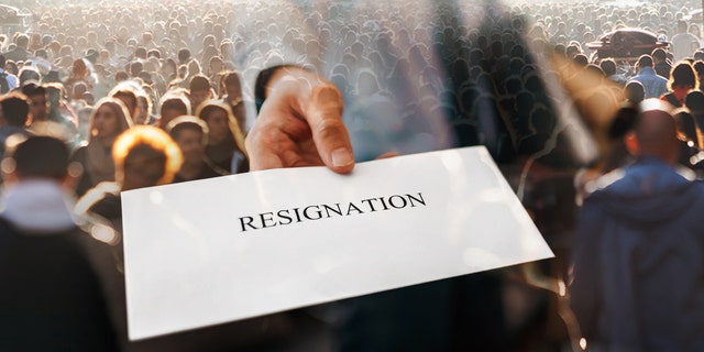 An employee hands over a letter of resignation.
