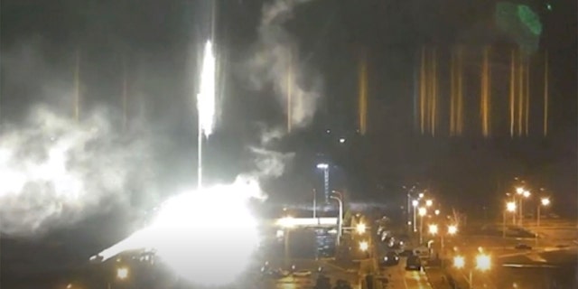 This image made from a video released by Zaporizhzhia nuclear power plant shows bright flaring object landing in grounds of the nuclear plant in Enerhodar, Ukraine Friday, March 4, 2022. Russian forces shelled Europe’s largest nuclear plant early Friday, sparking a fire as they pressed their attack on a crucial energy-producing Ukrainian city and gained ground in their bid to cut off the country from the sea.