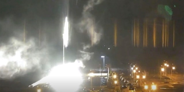 This image made from a video released by Zaporizhzhia nuclear power plant shows bright flaring object landing in grounds of the nuclear plant in Enerhodar, Ukraine Friday, March 4, 2022. Russian forces shelled Europe’s largest nuclear plant early Friday, sparking a fire as they pressed their attack on a crucial energy-producing Ukrainian city and gained ground in their bid to cut off the country from the sea.