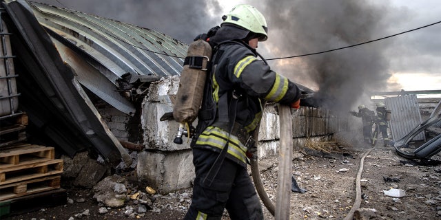 Firefighters try to extinguish a fire after a chemical warehouse was hit by Russian shelling on the eastern frontline near Kalynivka village on March 08, 2022, in Kyiv, Ukraine.