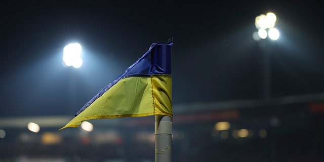 A corner flag replaced by a Ukraine flag on the pitch during the FA Cup fifth- round soccer match between Luton Town and Chelsea at Kenilworth Road in Luton, England, Wednesday, March 2, 2022. 