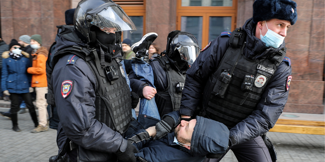   Russian policemen arrest a man during an unauthorized protest rally against the military invasion of Ukraine on March 6, 2022 in Moscow, Russia.  Russia invaded neighboring Ukraine on February 24, 2022, its actions have been condemned around the world with rallies, demonstrations and peace marches taking place in cities around the world.