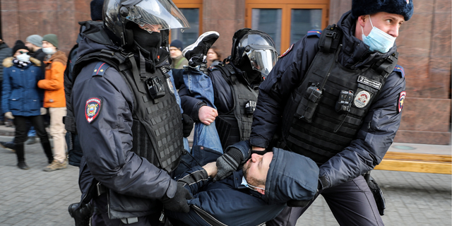  Russian Police officers detain a man during an unsanctioned protest rally against the military invasion in Ukraine on March 6, 2022 in Moscow, Russia. Russia invaded neighboring Ukraine on 24th February 2022, its actions have met with worldwide condemnation with rallies, protests and peace marches taking place in cities across the globe.