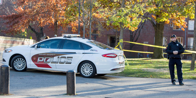 A Harvard University police officer blocks off access to the Harvard Yard following a bomb threat that was made on campus on November 16, 2015 in Cambridge, Massachusetts.