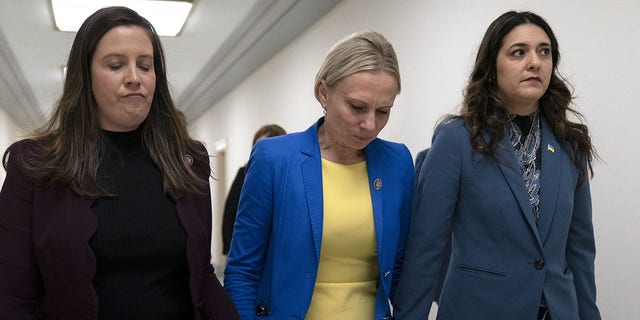 Rep. Elise Stefanik, R-N.Y., left, and Rep. Stephanie Bice, R-Okla., right, hold hands with Rep. Victoria Spartz, R-Ind., center, after the Indiana Representative, who emigrated from Ukraine, spoke about the war in Ukraine during a Republican news conference ahead of the State of the Union, Tuesday, March. 1, 2022, on Capitol Hill in Washington. (WHD Photo/Jacquelyn Martin)