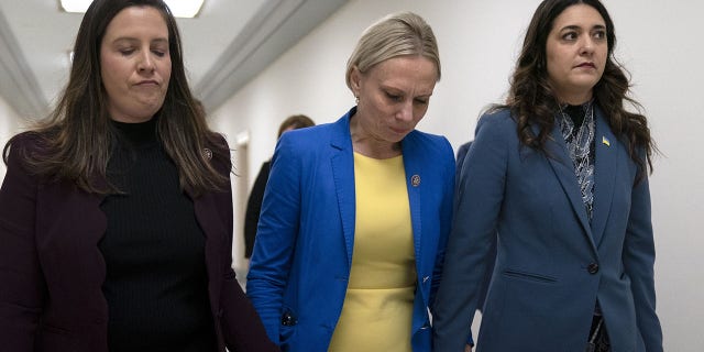 Rep. Elise Stefanik, R-N.Y., left, and Rep. Stephanie Bice, R-Okla., right, hold hands with Rep. Victoria Spartz, R-Ind., center, after the Indiana Representative, who emigrated from Ukraine, spoke about the war in Ukraine during a Republican news conference ahead of the State of the Union, Tuesday, March. 1, 2022, on Capitol Hill in Washington. (WHD Photo/Jacquelyn Martin)